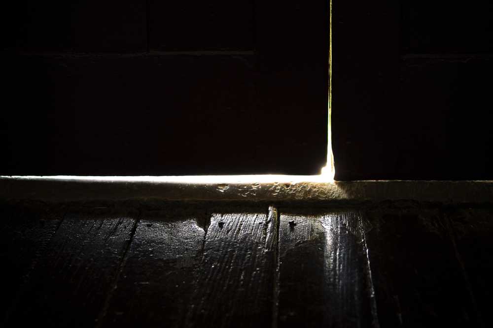 light through crack in door
